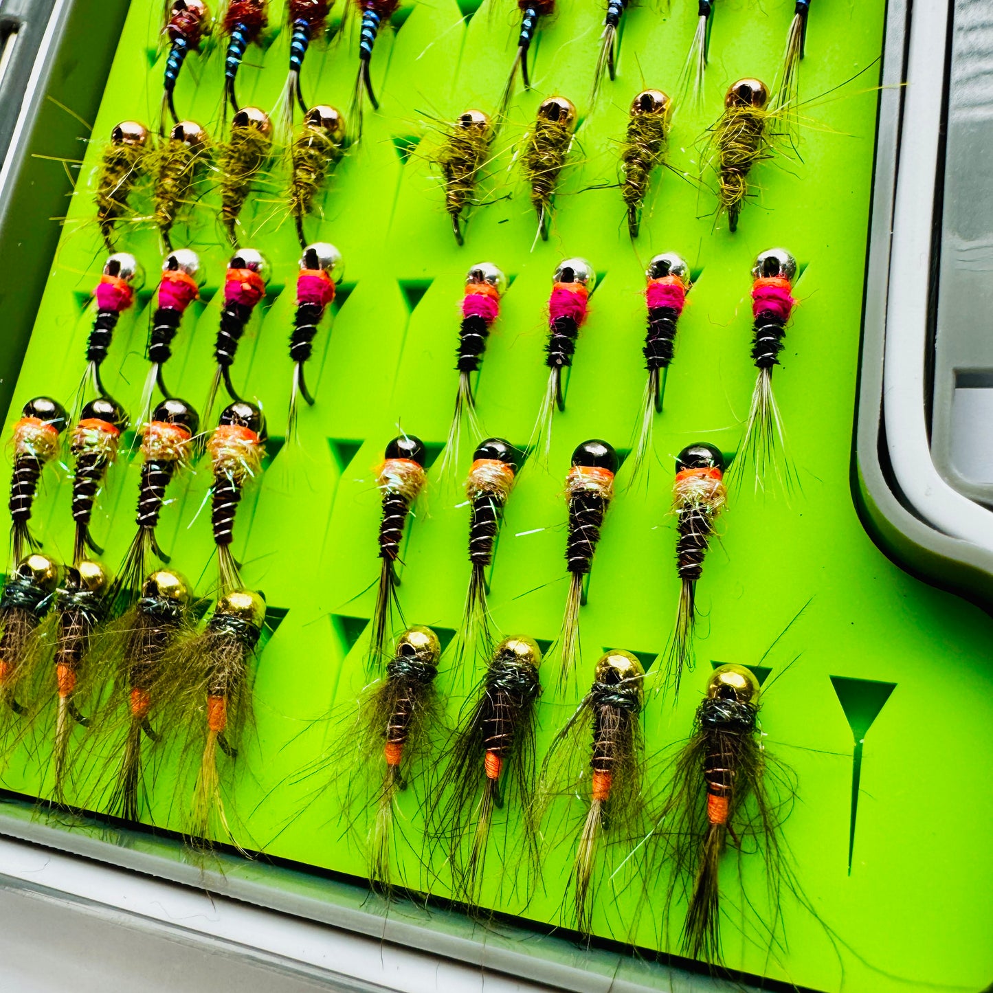 The Depth Charge Fly Box by Fly Life Outdoors showing an angled shot of the bottom row of flies.