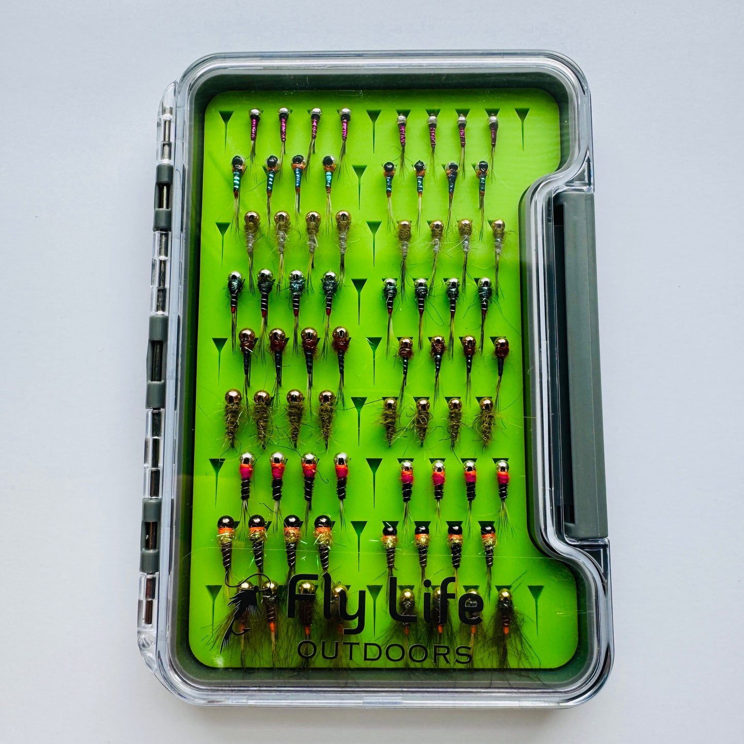 The Depth Charge Fly Box by Fly Life Outdoors in a closed overhead shot showing off the sturdy fly box that protects the flies.