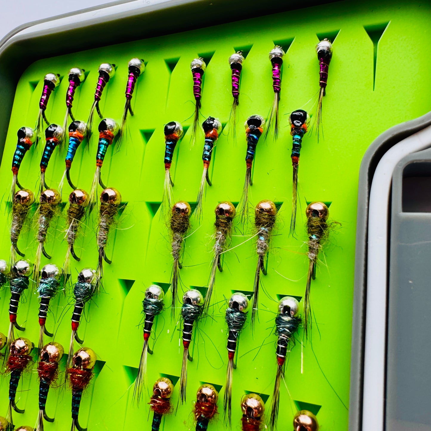 The Depth Charge Fly Box by Fly Life Outdoors showing an angled shot of the top row of flies.