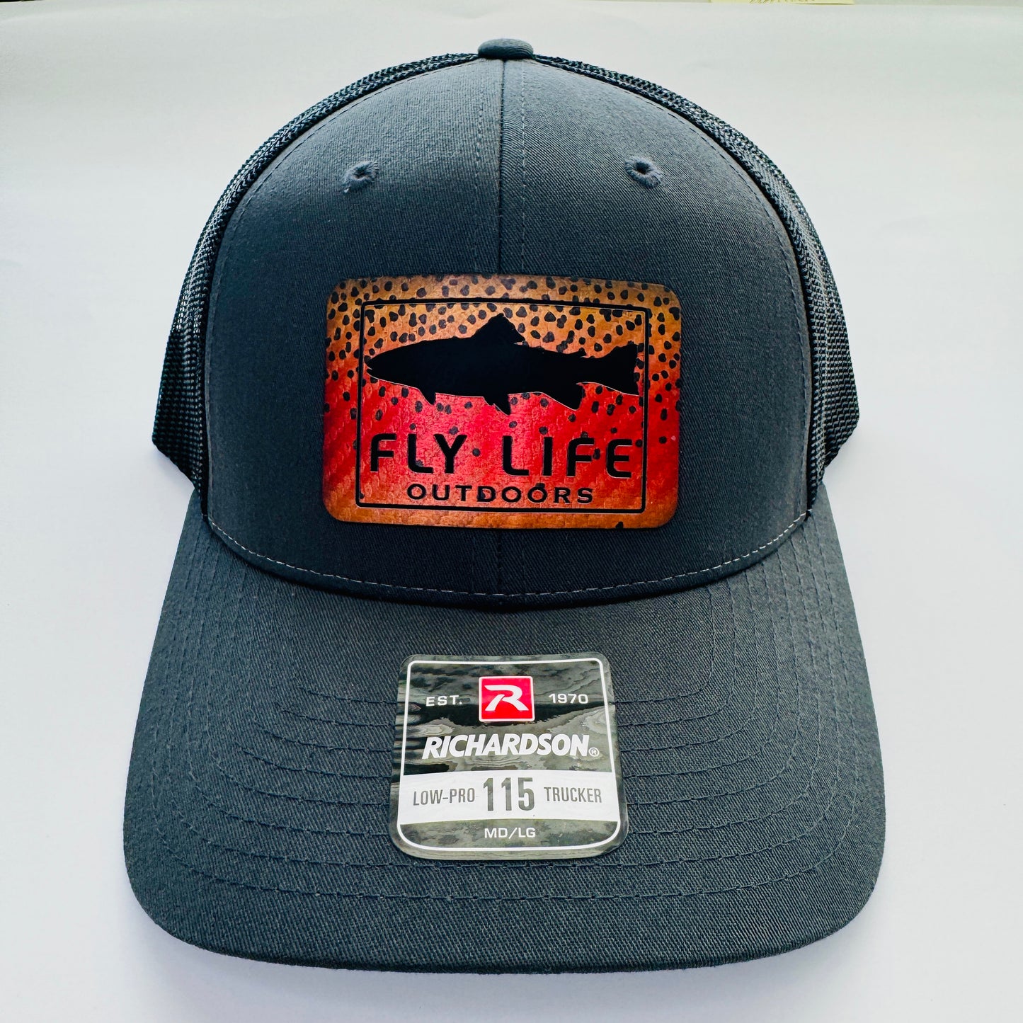 Front view of The FLO 115 Trucker in Charcoal with Black Trout/Cutthroat patch | Charcoal/Black
