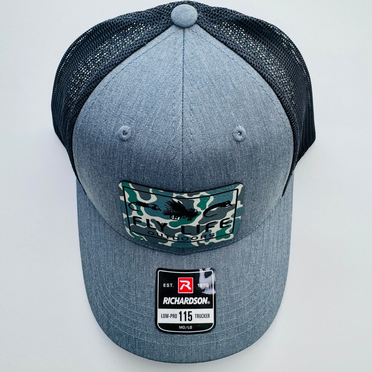 Top view of The FLO 115 Trucker in Heather with Black Tri-Fly/Low Tide Camo patch | Heather Grey/Black