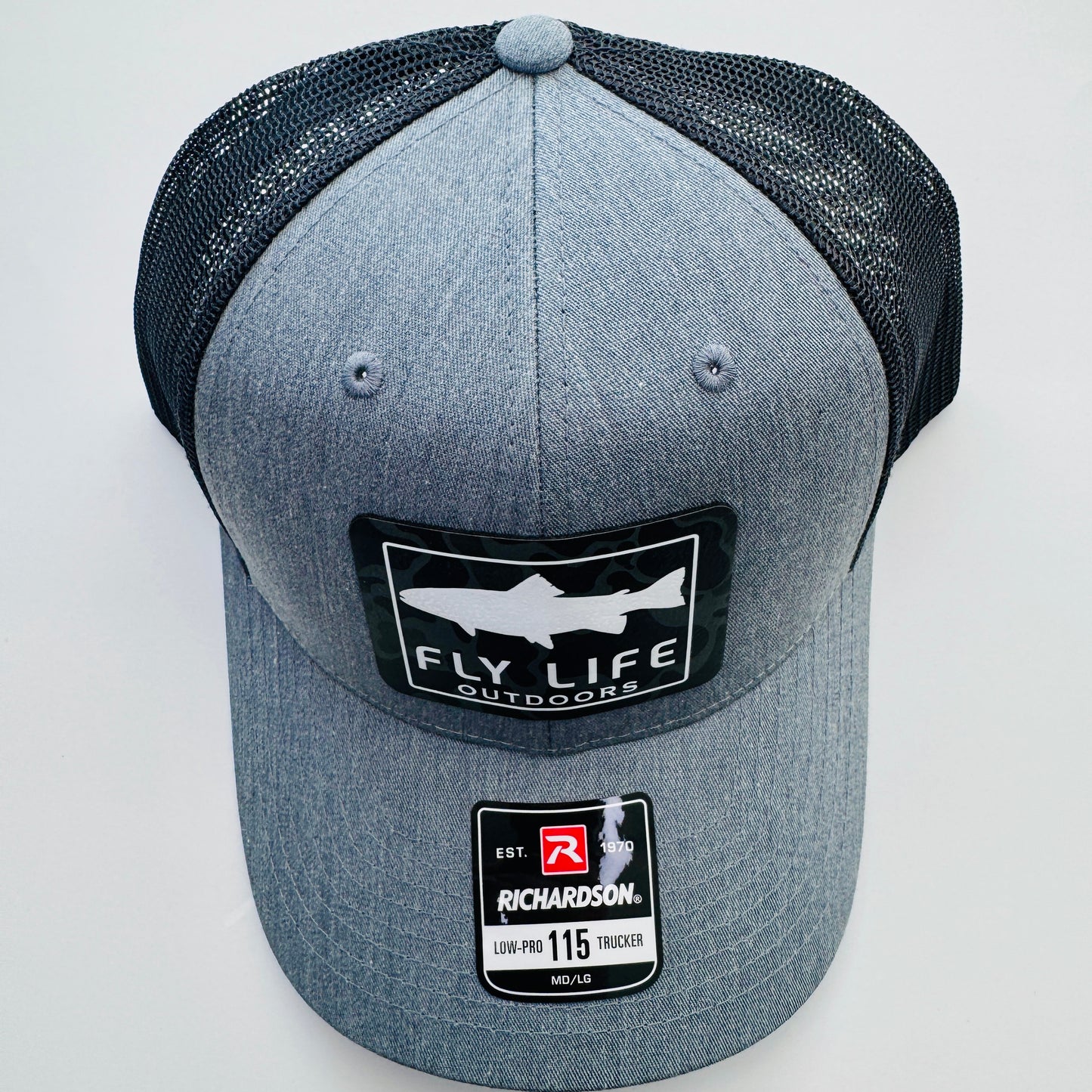 Top view of The FLO 115 Trucker in Heather Grey with White Trout/Black Skies Camo patch | Heather Grey/Black