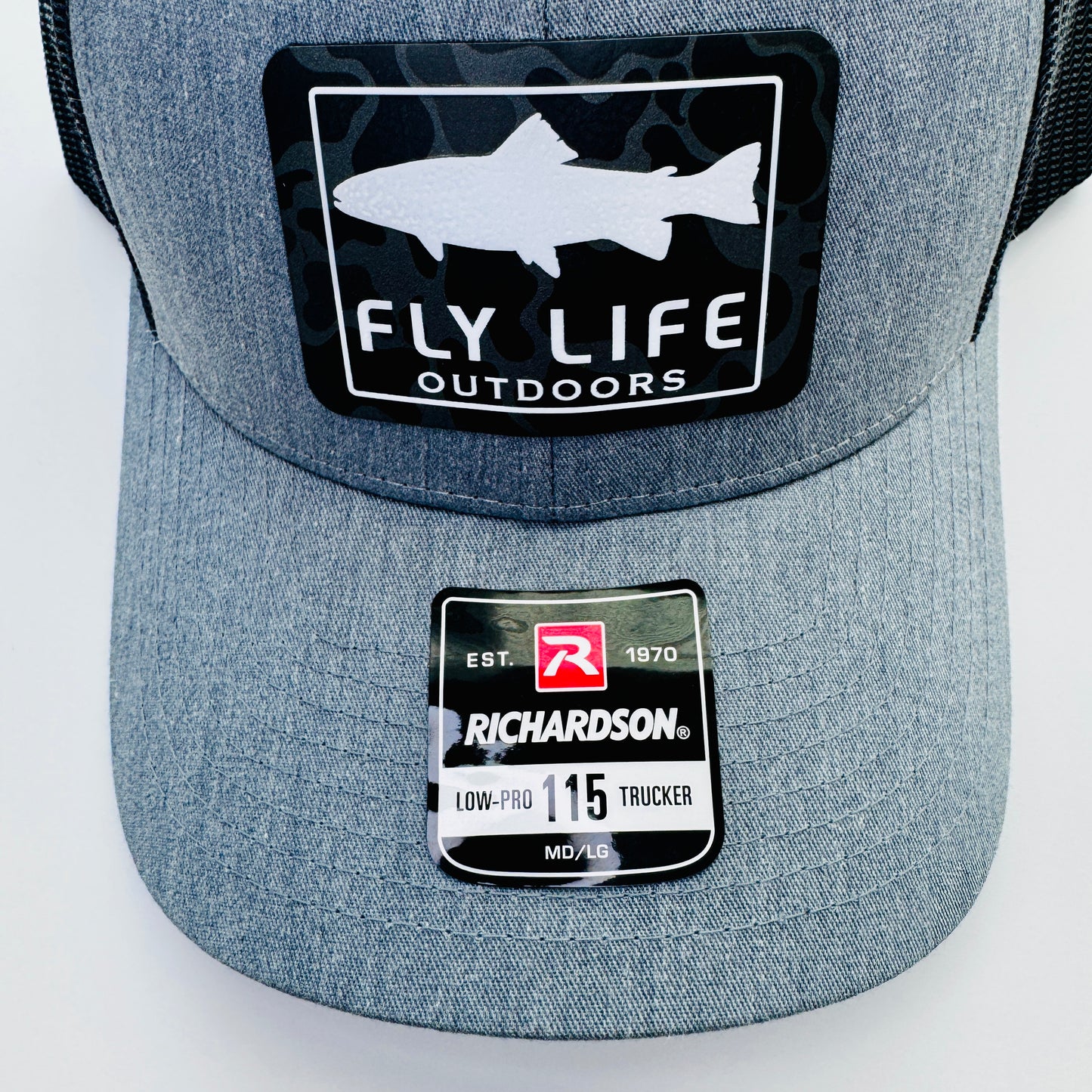 Close up patch view of The FLO 115 Trucker in Heather Grey with White Trout/Black Skies Camo patch | Heather Grey/Black