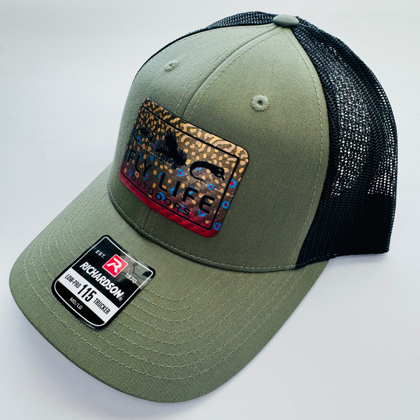 Right angle view of The FLO 115 Trucker in Olive with Black Tri-Fly/Brook Trout patch | Olive/Black