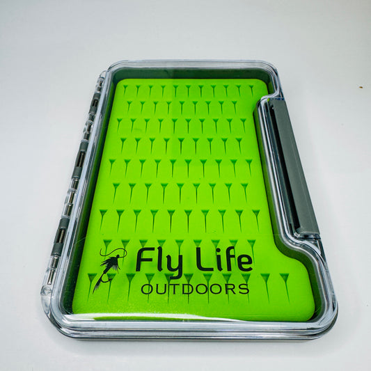 An angled shot of the durable Guardian Fly Box (Large) closed, showing the crystal-clear lid and secure latch system for fly storage.