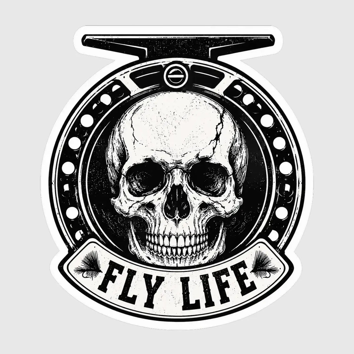 Black and white sticker featuring a skull inside a fly reel with Fly Life lettering and two fishing flies