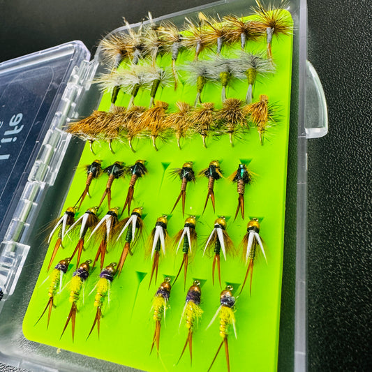 An angler's pocket-sized fly box, fully loaded with 42 proven trout patterns from Fly Life Outdoors.