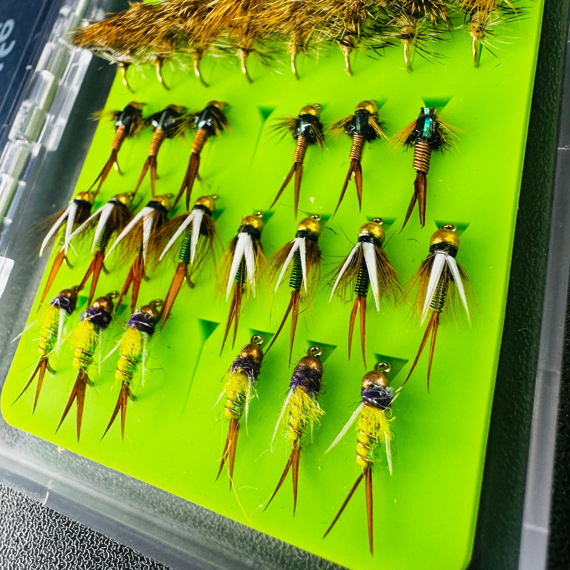 Close-up view of the hand-tied dry flies inside the Mini Essentials Fly Box.