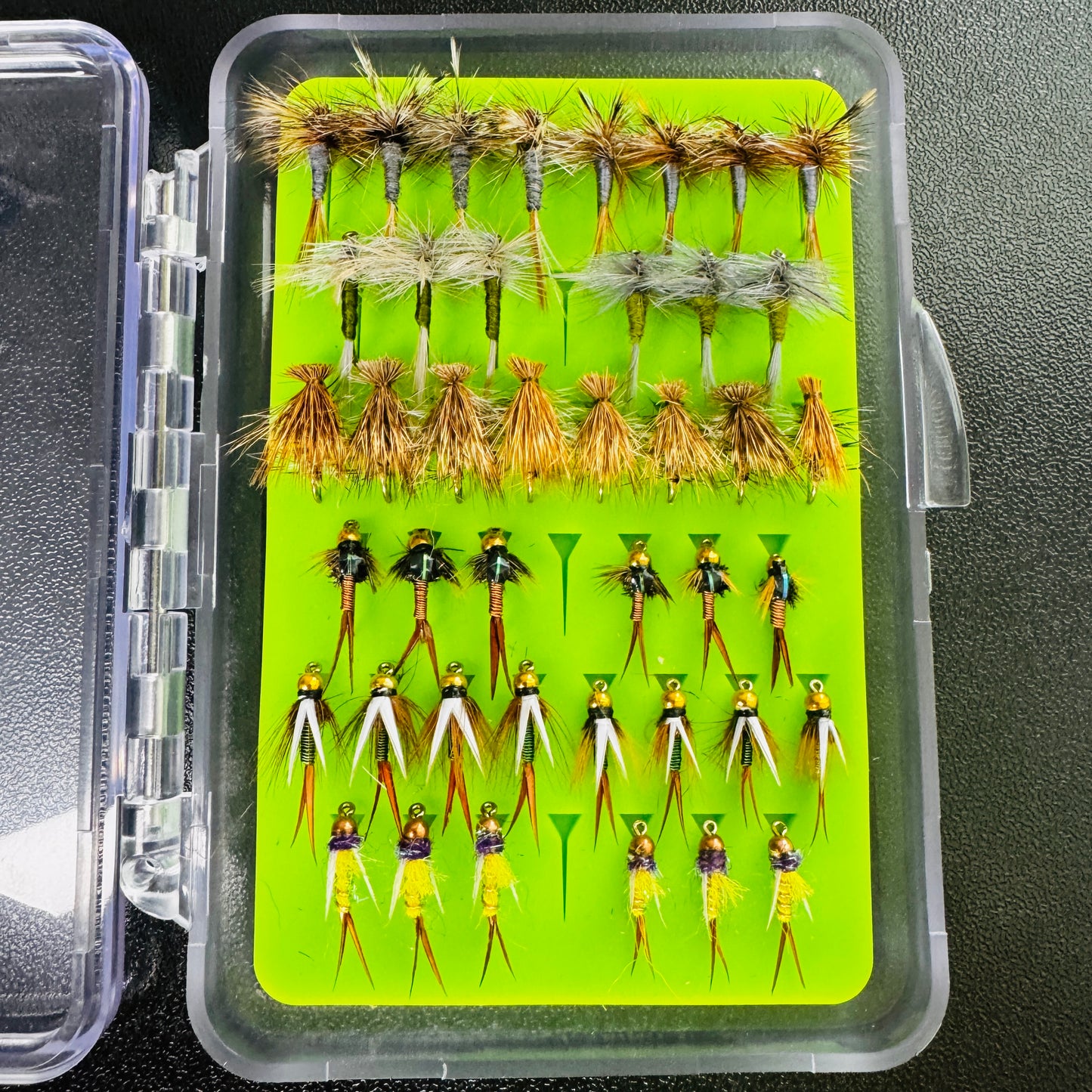 The Mini Essentials Fly Box from Fly Life Outdoors, open to show 42 hand-tied trout flies.