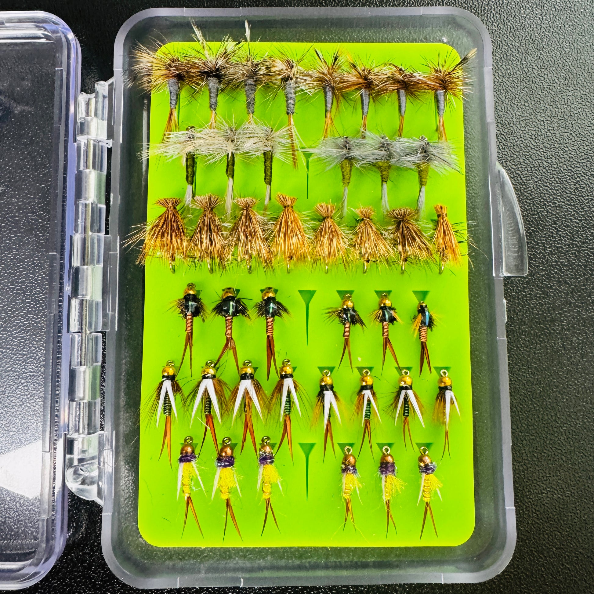 The Mini Essentials Fly Box from Fly Life Outdoors, open to show 42 hand-tied trout flies.
