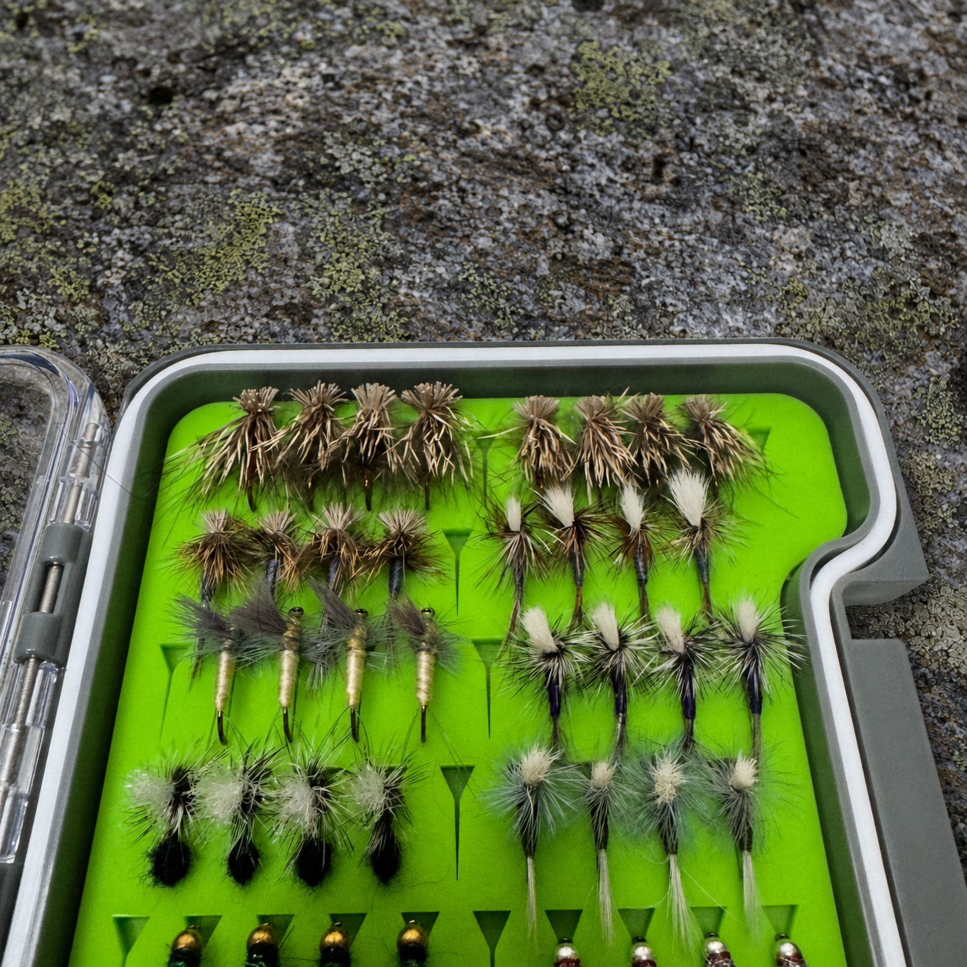Close-up of All-Water Arsenal fly box dry fly section showing hand-tied Elk Hair Caddis, Parachute Adams, BWOs, and Griffith's Gnats for WNC trout streams