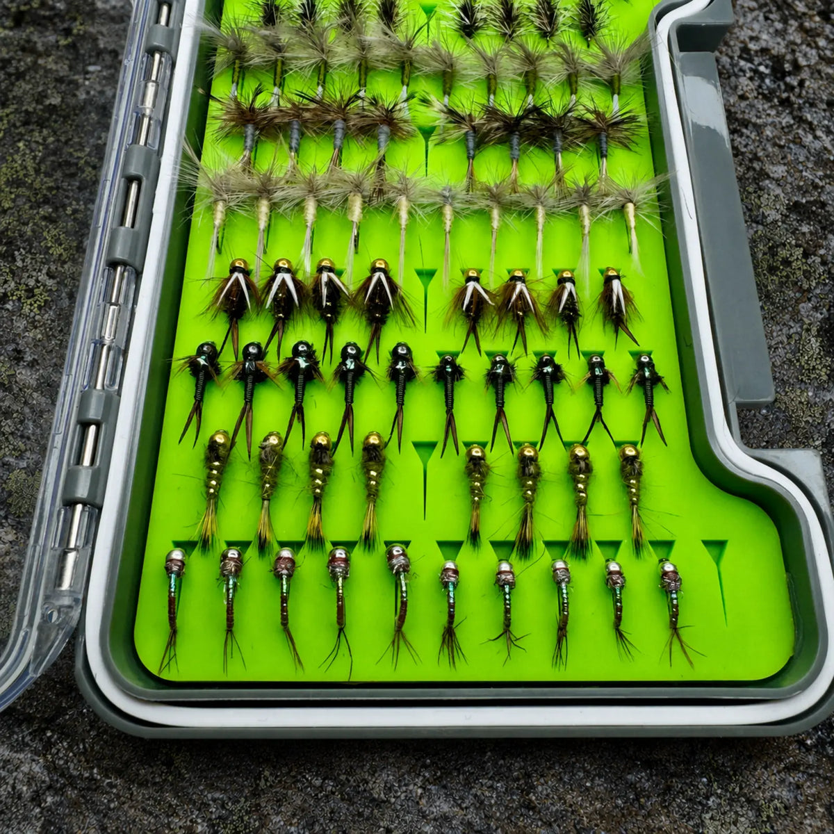 Close-up of Essentials fly box nymph section showing Copper Johns, Prince Nymphs, Hare's Ear, and Rainbow Warriors for Delayed Harvest and Hatchery Supported trout water