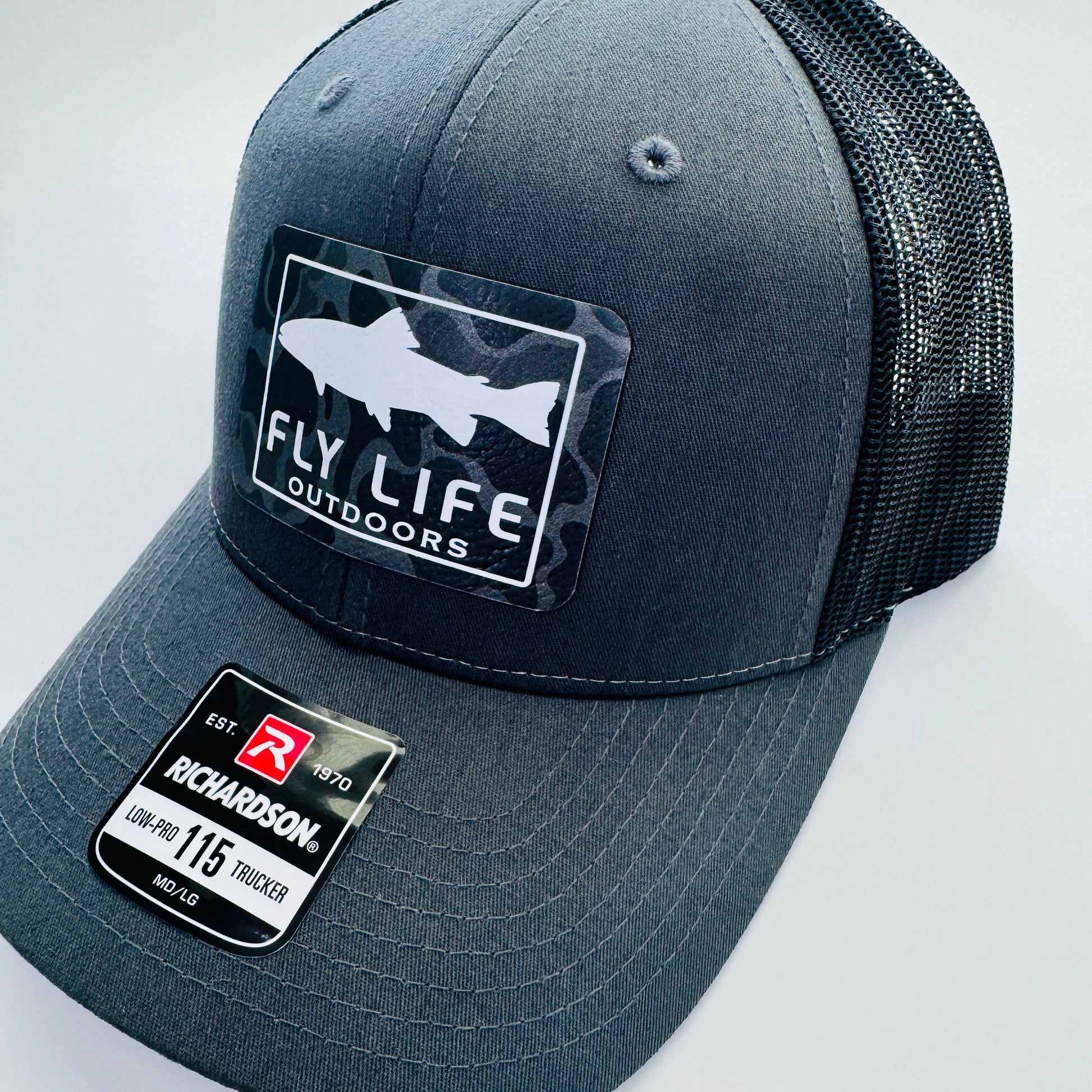 Right view of The FLO 115 Trucker in Charcoal with White Trout/Black Skies Camo patch | Charcoal/Black