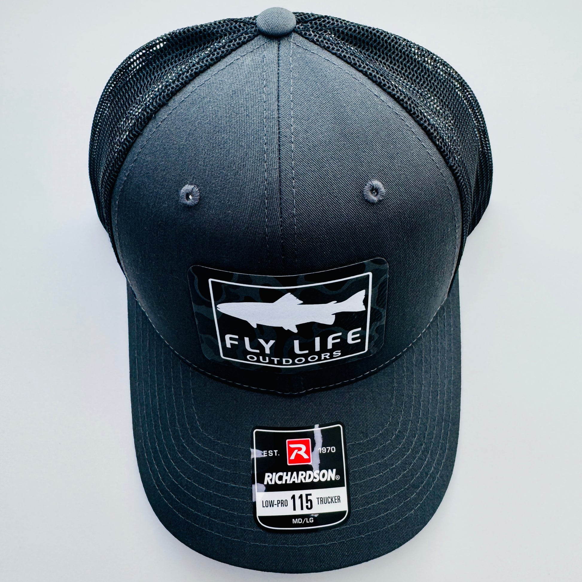 Top view of The FLO 115 Trucker in Charcoal with White Trout/Black Skies Camo patch | Charcoal/Black