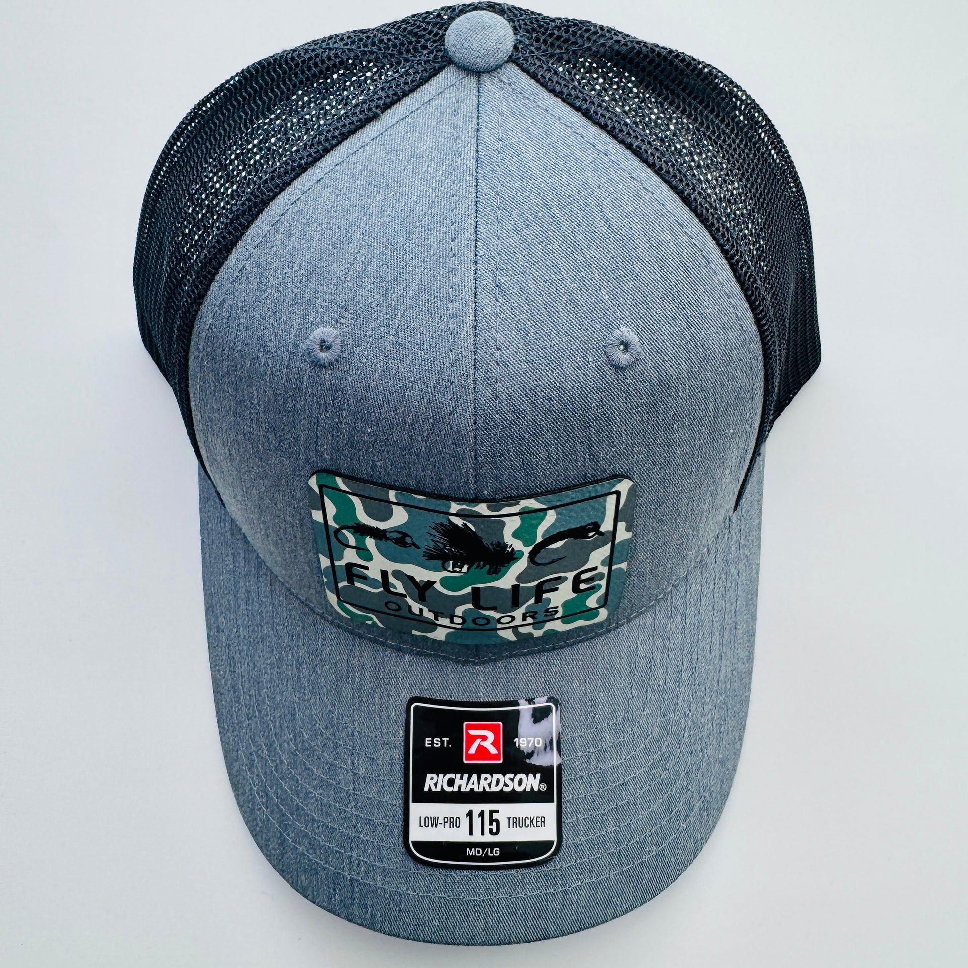 Top view of The FLO 115 Trucker in Heather with Black Tri-Fly/Low Tide Camo patch | Heather Grey/Black
