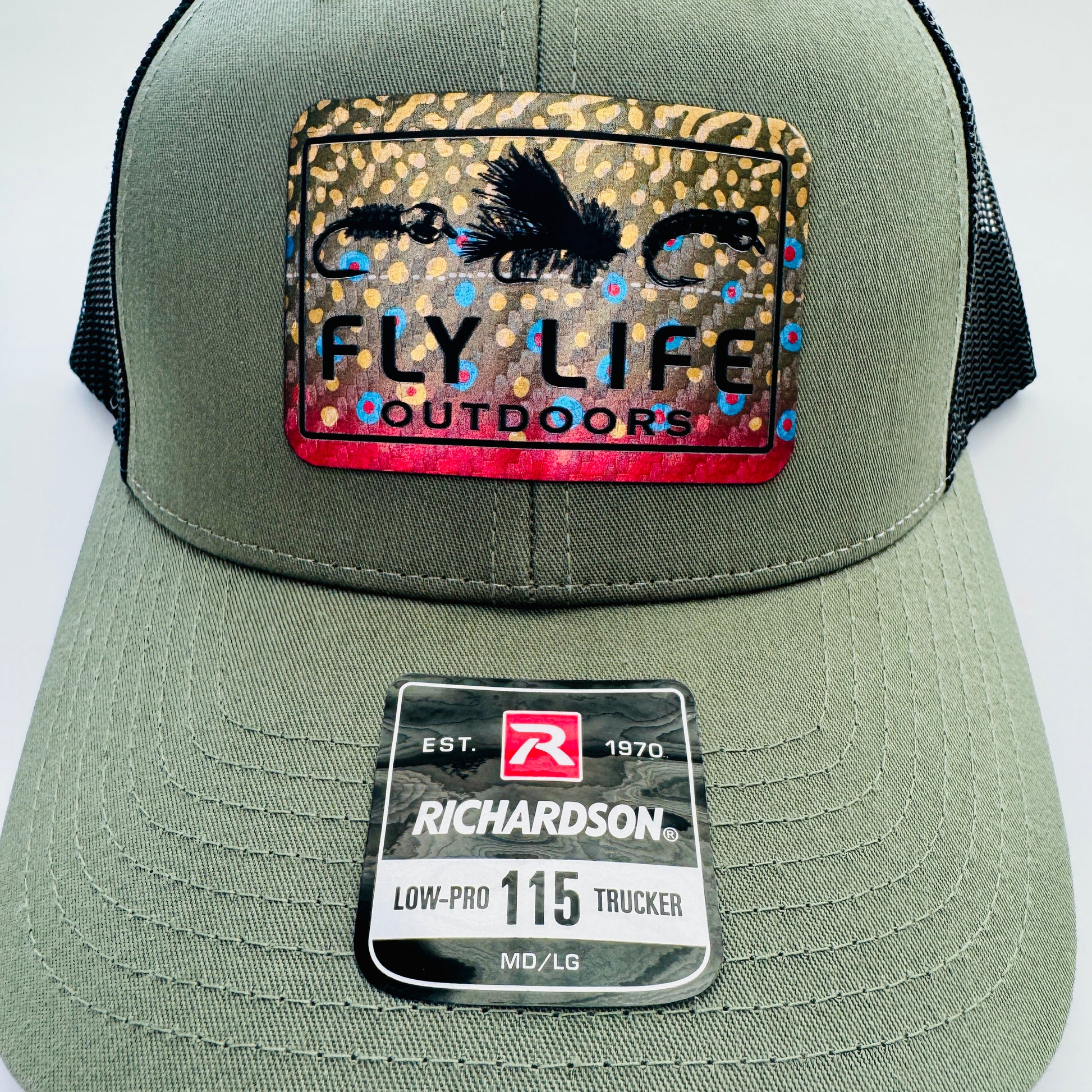 Close up view of The FLO 115 Trucker in Olive with Black Tri-Fly/Brook Trout patch | Olive/Black