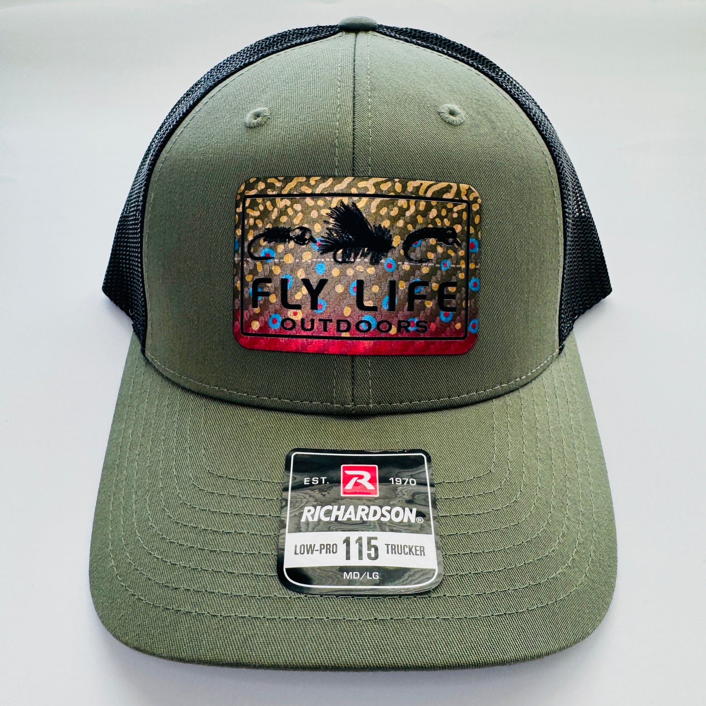 Front view of The FLO 115 Trucker in Olive with Black Tri-Fly/Brook Trout patch | Olive/Black