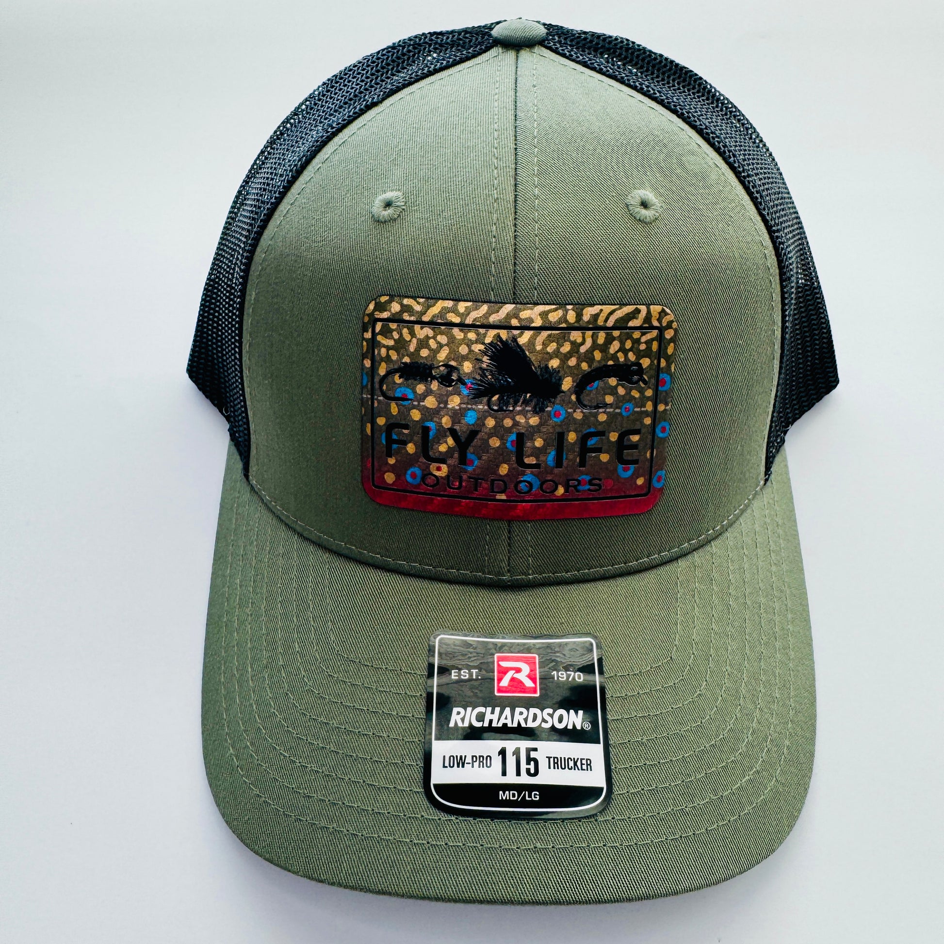 Top and front angle view of The FLO 115 Trucker in Olive with Black Tri-Fly/Brook Trout patch | Olive/Black