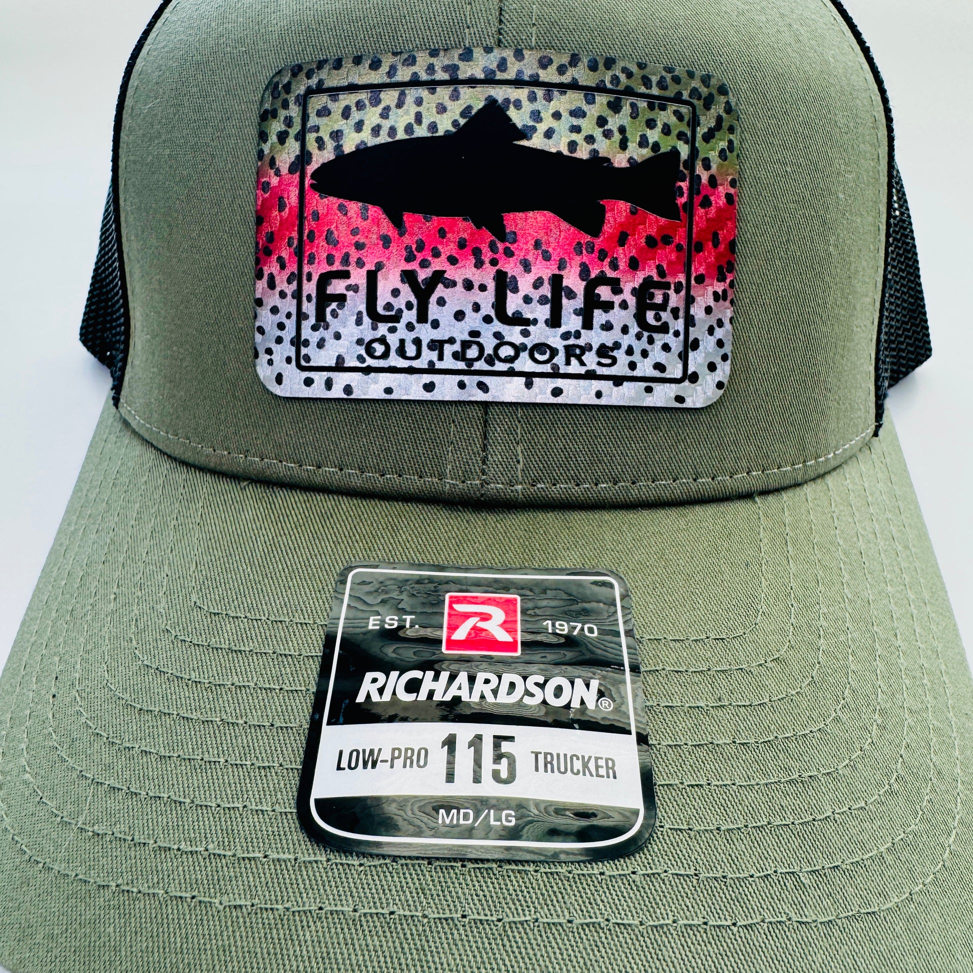 Close up front view of The FLO 115 Trucker in Olive with Black Trout/Rainbow Trout patch | Olive/Black