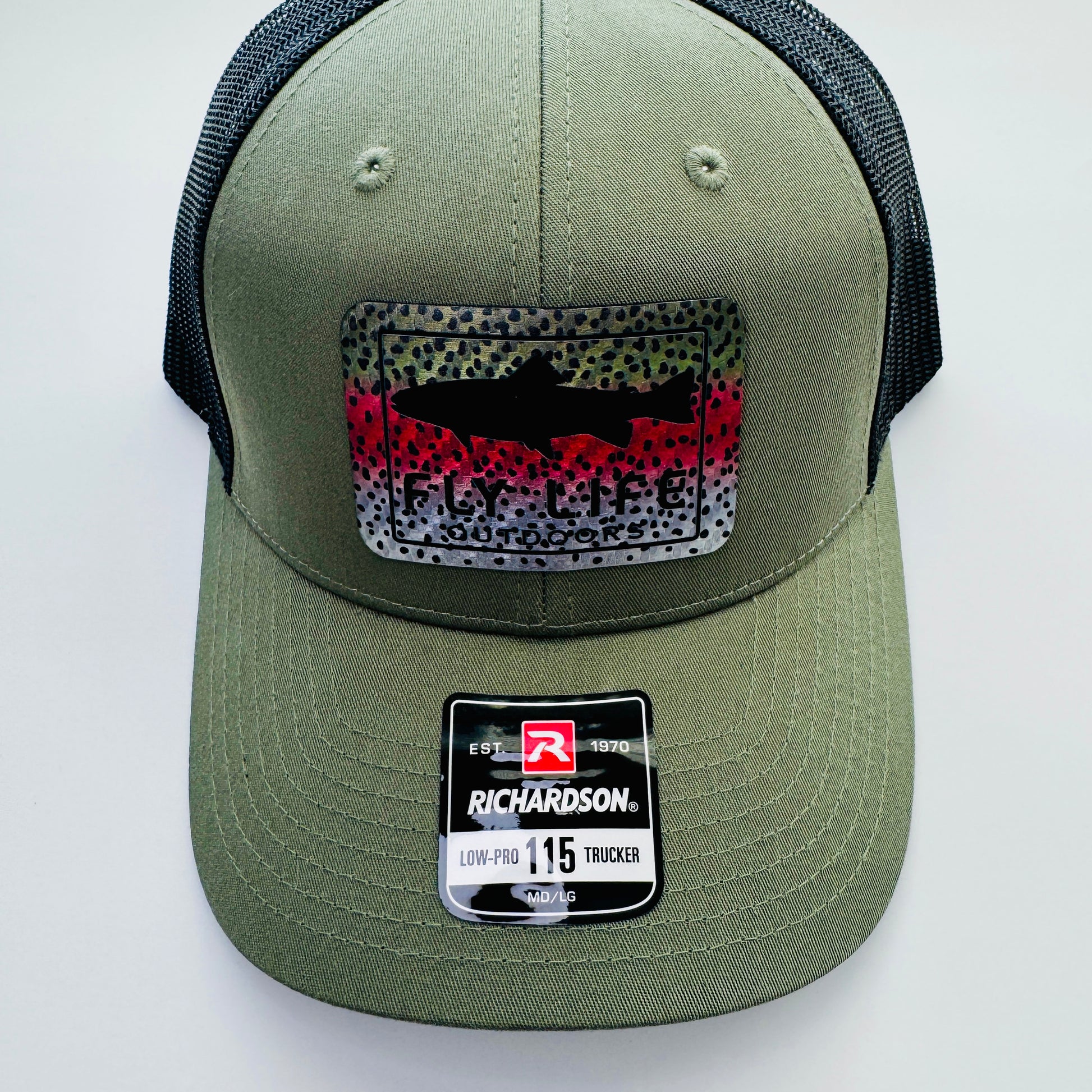 Top view of patch and bill of The FLO 115 Trucker in Olive with Black Trout/Rainbow Trout patch | Olive/Black